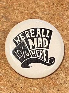 1,25" We're All Mad here 10/6 Hutform Button Pinback *gebraucht* DTA - Bild 1 von 3