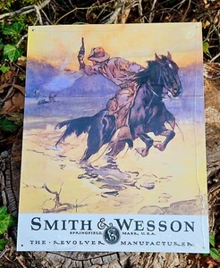 SIGNO DE HOJALATA SMITH & WESSON CABALLO Y VAQUERO armas de fuego western s&w decoración vintage EE. UU. - Imagen 1 de 5