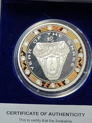 NIUE 2013 1 DOLLAR SILVER PLATED SNAKE BITE COIN w/CASE+COA - Image 1 of 4