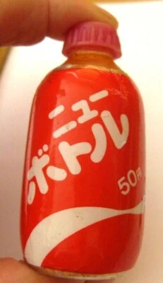 Vintage 70s Japanese Mini "New Bottle" Brand Candy Dispenser Toy Pink Pellets - Image 1 of 4