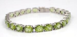 PERIDOT STERLING SILVER TENNIS BRACELET WITH 23 GEMSTONES 7.75 INCHES