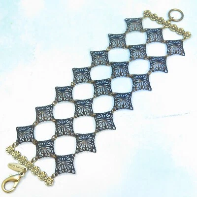 Brazalete Lenora Dame Fino Filigrana Diamante Patrón Oro y Negro Triple Fila Eslabones Foto 1 de 4