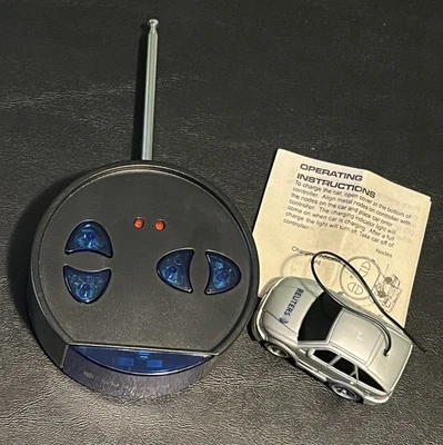 Reuters MINI RC CAR - Travel Remote Control Silver, Small Kids Toy, Untested - Image 1 of 4