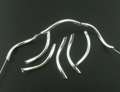 200 pcs Silver Plated Noodle Tube Long Thin Smooth Twisted Curved Beads – 26mm  - Image 1 of 2