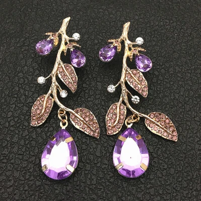 Pendientes perforados de lágrima con hoja de cristal púrpura para mujer Foto 1 de 3