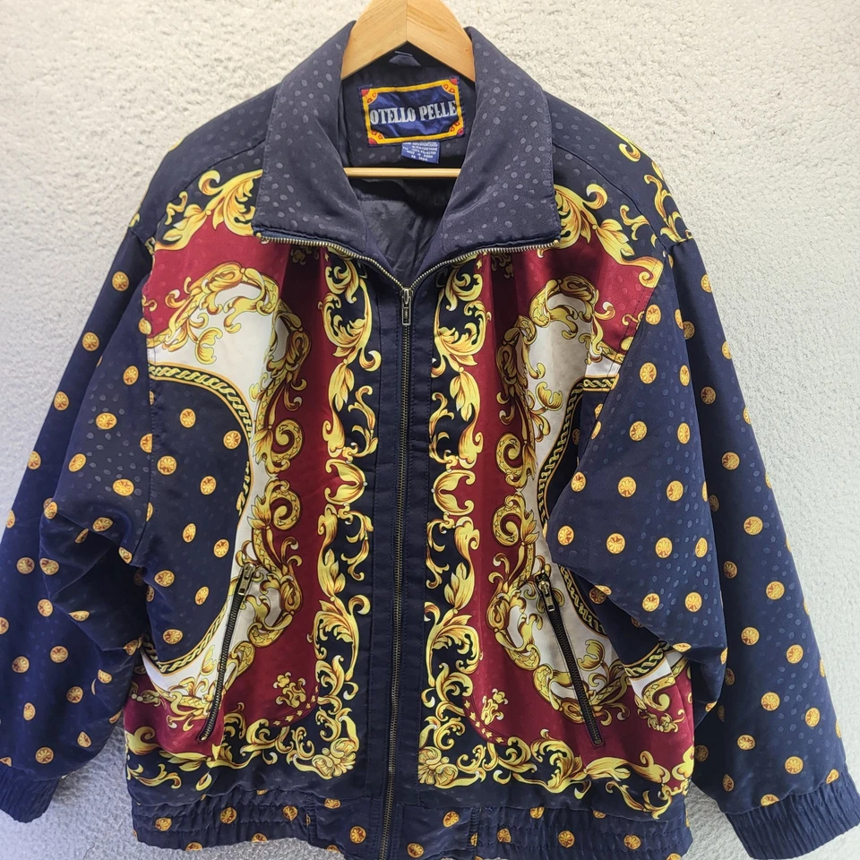 Chaqueta cortavientos Otello Pelle para mujer azul medio cadenas AOP dorada de gran tamaño Foto 1 de 4