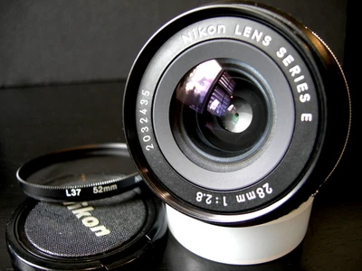 Lente gran angular NIKON 28 mm f/2,8 serie E AIS con filtro L37 F FE FM FA FG EM Foto 1 de 4