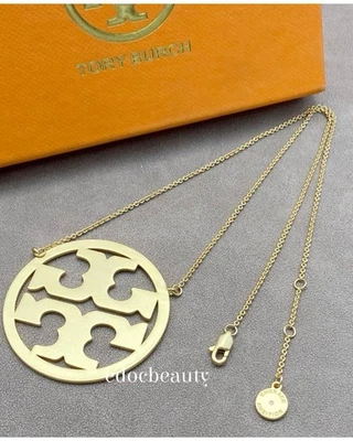 Collar colgante grande con logotipo dorado Tory Burch💛🧡 Foto 1 de 4