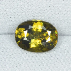 1.50 ct SPARKLING FINE BROWN YELLOW SPARKLING / NATURAL SPHENE - Oval See Vdo DB - Picture 1 of 2
