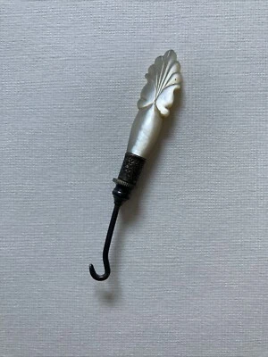 ANTIQUE VICTORIAN MOTHER OF PEARL AND METAL BUTTON /GLOVES HOOK - Image 1 of 4