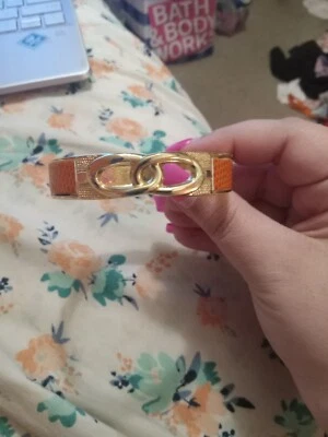 Pulsera Infinita Magnética Tono Dorado y Naranja Foto 1 de 4