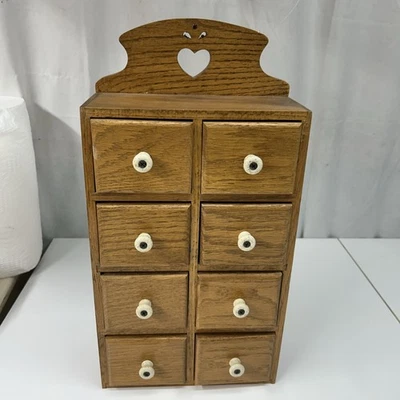 Vintage Wooden Apothecary/Spice Cabinet 8 Drawer Ceramic Knobs Heart Cut Out - Image 1 of 4