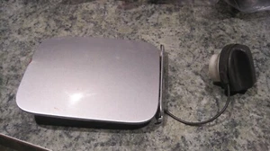 2012 NISSAN JUKE Fuel Tank Door Chrome Silver Metallic Paint Code KYO CHIP BLEM - Picture 1 of 4
