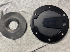 2010-2014 Shelby Mustang Black Anodized Aluminum Fuel Door - Picture 1 of 5