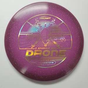 Discraft Z Sparkle Glo Drohne - 2023 Ledgestone Edition Purple Glow 177+ Gramm - Bild 1 von 1