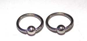 2- Sexy Shiny 12mm Pre Adjusted Surgical Steel Captive Ear Hoop Ring 14g 1/2 - Picture 1 of 3