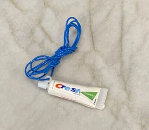 VTG Crest Toothpaste Plastic Charm Necklace with Blue Plastic Cord Necklace - Picture 1 of 2