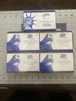2006 Proof Set, (2) 2002 Quarter Sets,and (2) 2003 Quarter Sets. - Image 1 of 4
