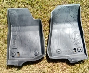 Pre-owned OEM Mopar Jeep Wrangler 2 Front Rubber Floor Mats w/ T-Rex Head - Picture 1 of 10