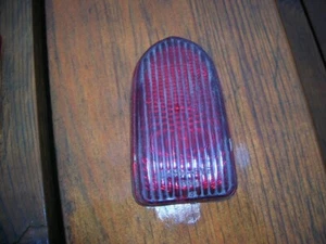 1949 Chevy Ruby Glass Stop/Tail Lamp Lens Lynx-Eye #: T-336 repl. GM #: 5937861 - Picture 1 of 2