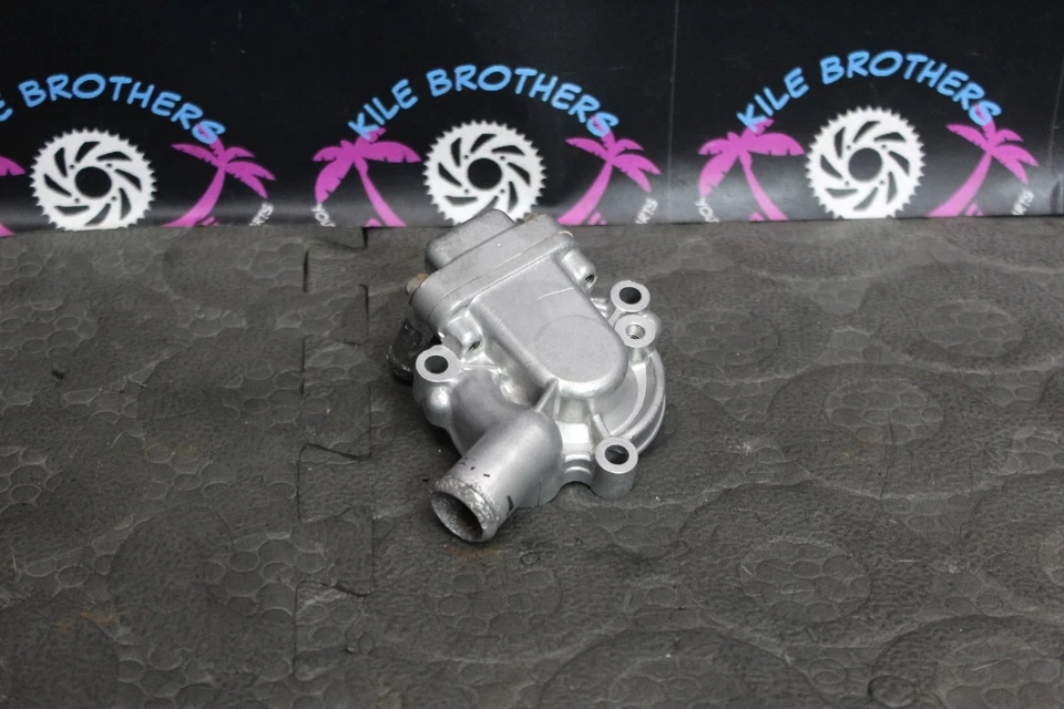 1999 Kawasaki 92-99 KX250 OEM двигатель водяной насос крышка корпуса 16142-1117 - Изображение 1 из 4