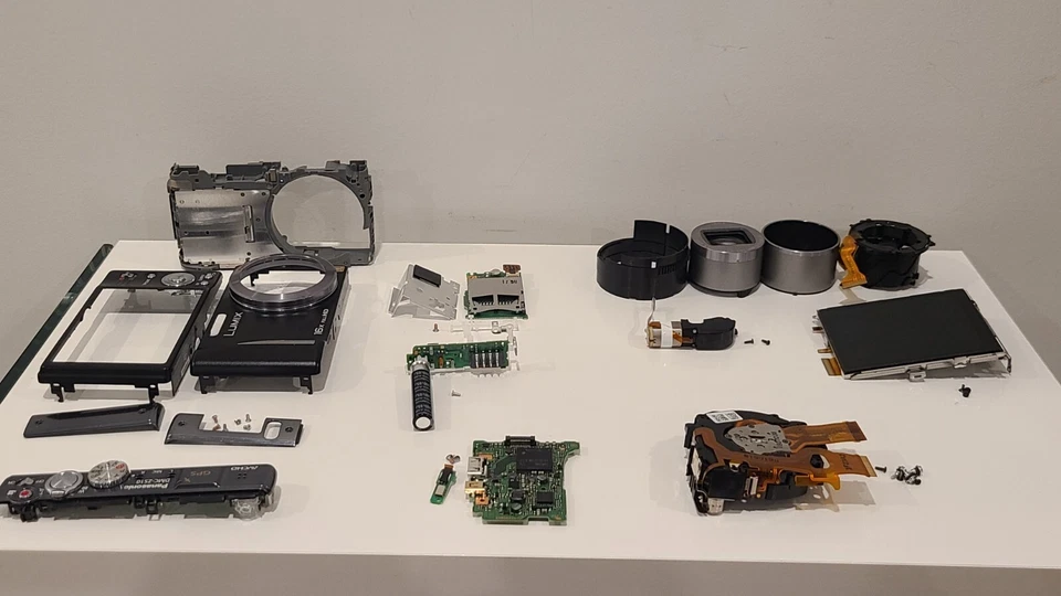 Panasonic DMC-ZS10 Digital Camera Repair Parts LCD Frame PCB Motor - Image 1 of 1