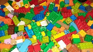 Duplo bundle over 1kg of random bricks and wheel bases mixed shapes and colours
