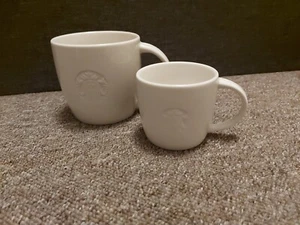 2 Starbucks White China Mugs with Embossed Mermaid logo size V and S - Picture 1 of 7