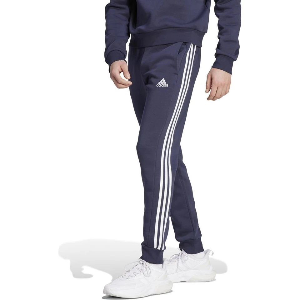 Adidas Essentials 3 strisce Tapered Cuff pantaloni da jogging da uomo pantaloni della felpa pantaloni sportivi - Immagine 1 di 1