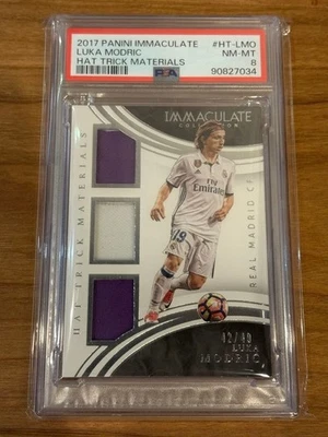 2017 PANINI IMMACULATE LUKA MODRIC HAT TRICK MATERIALS #HT-LMO PSA 8 - Image 1 of 2