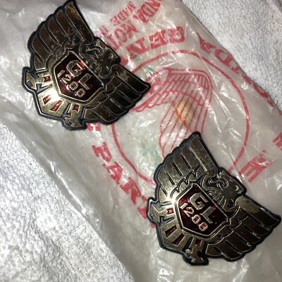 84-87 Honda GL1200 GL 1200 Goldwing Side Cover Badge Emblem B P/N: 83606-MG9-000 - Image 1 of 2