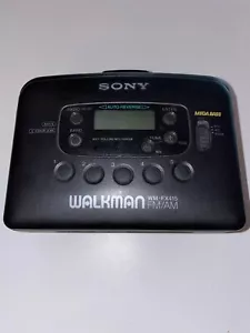 Sony WM-FX415 AM FM Cassette Walkman Parts Only Powers Up and Plays Tape Drags - Picture 1 of 3
