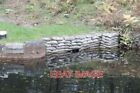 PHOTO  LOCK 27 OF THE BASINGSTOKE CANAL MOST LIKELY A CONCRETE-FILLED SANDBAG TO