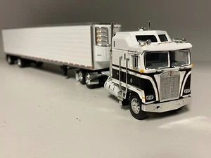 DCP 1/64 60-1558 BLACK & WHITE KENWORTH K100 AERODYNE LONG FRAME W/TK REEFER NIB - Picture 1 of 10