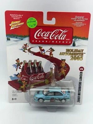 Johnny Lightning 2003 Mitsubishi Lancer, 2005 Coca Cola Christmas Ornaments - Image 1 of 4
