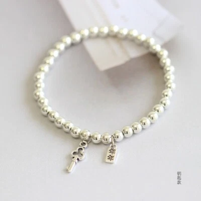 Silver Beaded Charm Bracelet Stretchable Bracelet with Two Charms - Image 1 of 4