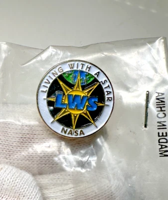 VINTAGE NASA LIVING WITH A STAR PIN UNOPENED E519 - Image 1 of 4