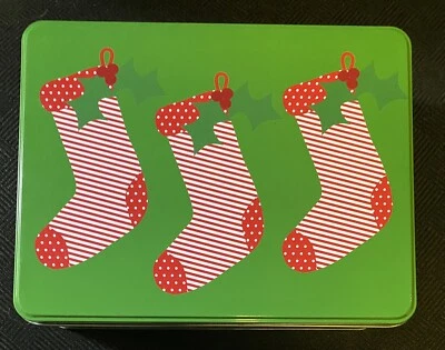 Preowned Rectangular Green Christmas Tin With Three Red Striped Stockings 7”x 9” - Image 1 of 4