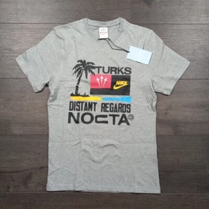 Nike NOCTA Drake Turks & Caicos Tshirt Men's Size Small Gray Distant Regards New - Picture 1 of 8