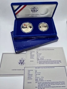Dólar de plata Liberty 1986 de los Estados Unidos y medio dólar en caja original con papeles - Imagen 1 de 4