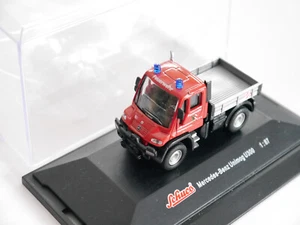 Mercedes Unimog U300 vigili del fuoco Norimberga motore antincendio, Schuco in 1:87 H0 in scatola - Foto 1 di 2