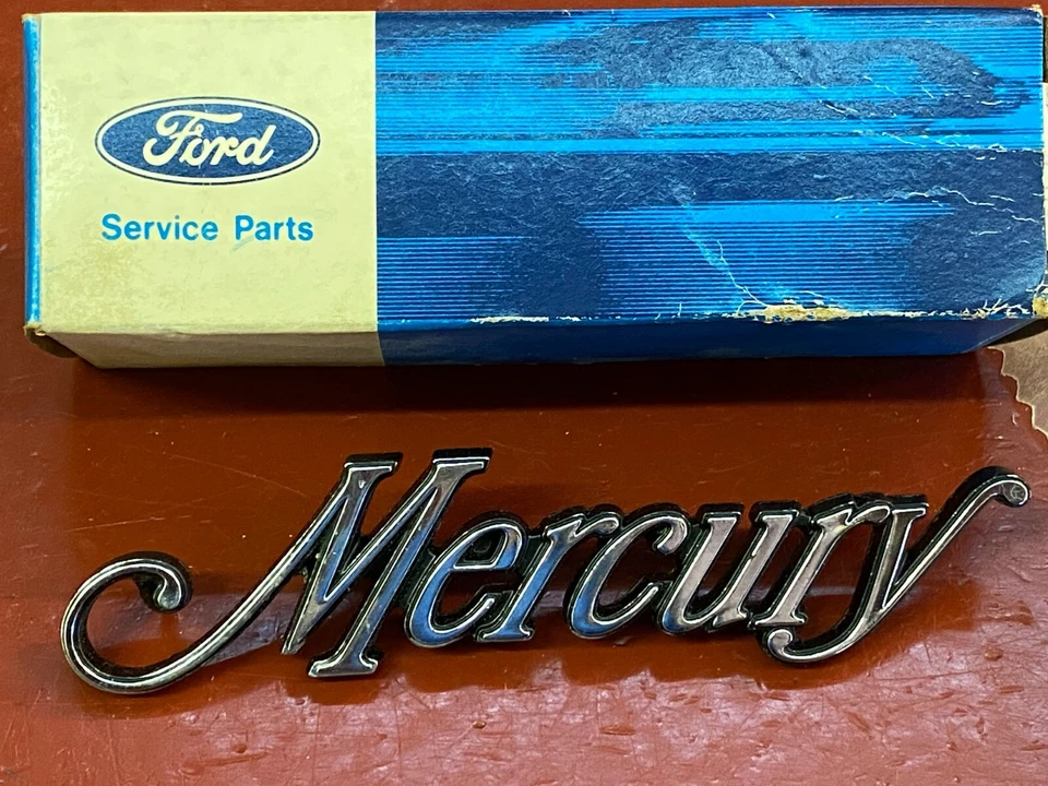 1974 MERCURY MONTEGO EMBLEM NAMEPLATE NOS - Image 1 of 1