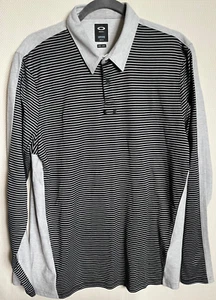 Polo Oakley Manga Larga, Rayas Negras Frontal, Gris Pálido Trasero, Grande - Imagen 1 de 7