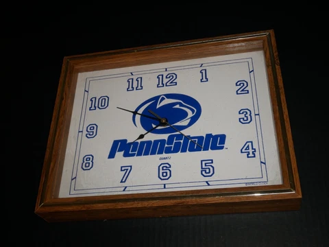 Penn State Quartz Wall Clock in wood case Battery operated by World Clocks works Cover