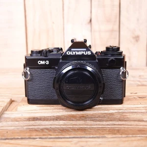 Gebrauchte Olympus OM-3 analoge Kleinbildkamera schwarz Gehäuse - Bild 1 von 7