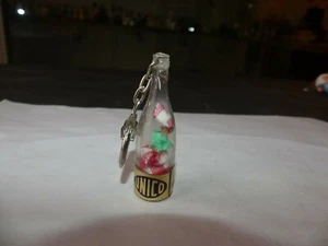 PORTE CLÉ PLASTIQUE BOUTEILLE POUPEE UNICO GRANDE QUINZAINE MARTINIQUAISE - Imagen 1 de 2