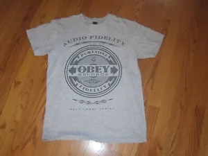 T-shirt grafica Obey Audio Fidelity Records serie Gold Label grigio-marrone media - Foto 1 di 5