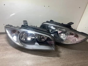 2010 BMW 1 SERIES PASSENGER & DRIVER SIDE FRONT HEADLIGHTS PAIR - Picture 1 of 9