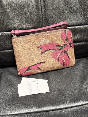 Bracciale Coach con zip angolare nuovo con etichetta in tela firmato con stampa fiocco CZ440