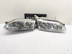 TOYOTA LEVIN AE110/111 1995 - 2000 HEADLAMP PAIR BRACKETS BROKEN 83881 - Picture 1 of 12